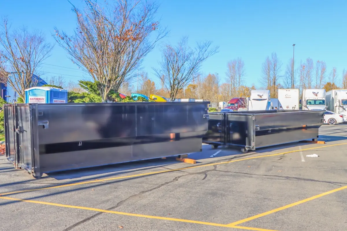 Professional dumpster rental service with roll-off container on residential driveway in Upper Mount Bethel